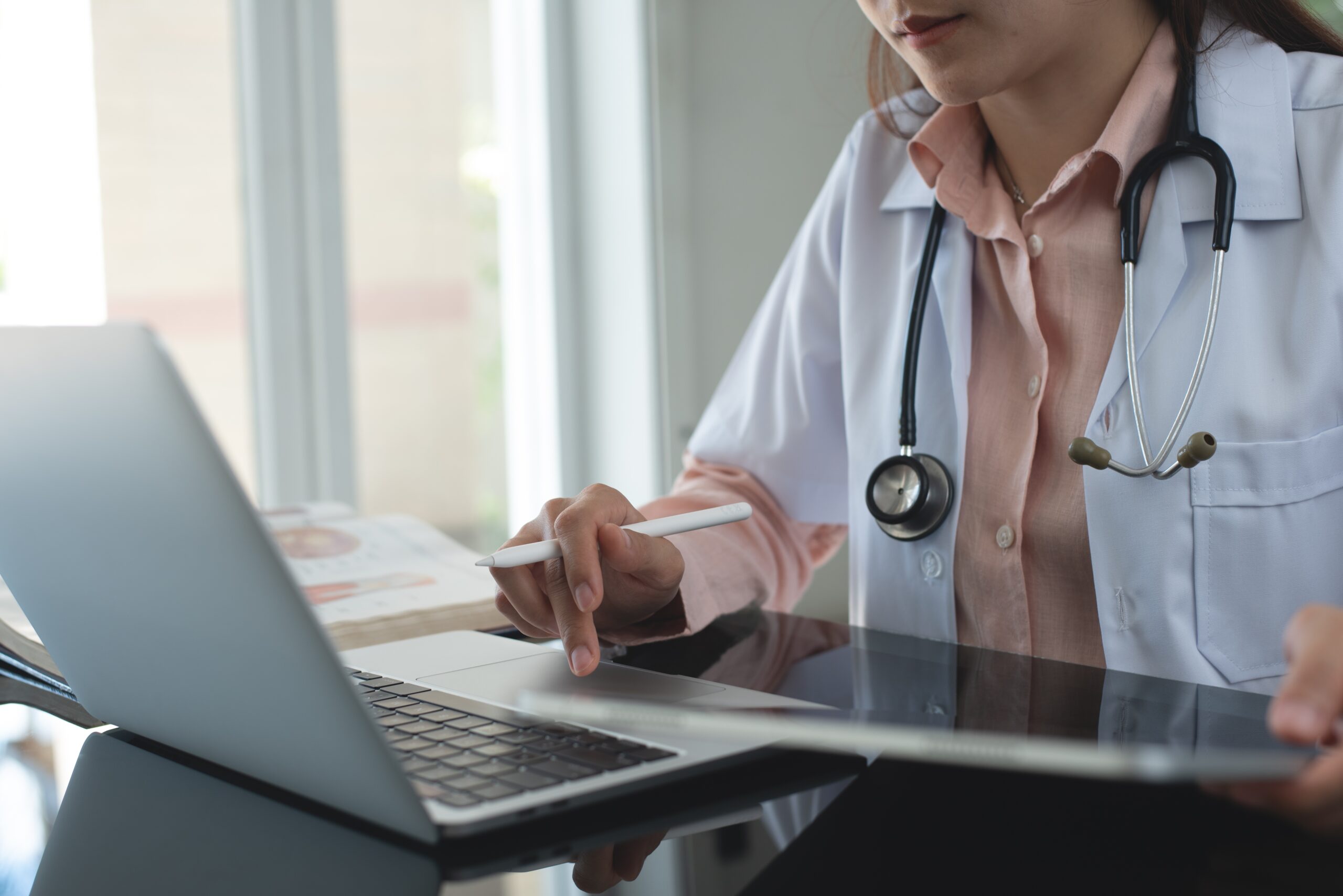 Female,Doctor,Working,On,Laptop,Computer,Searching,The,Information,And Female,Doctor,Working,On,Laptop,Computer,Searching,The,Information,And